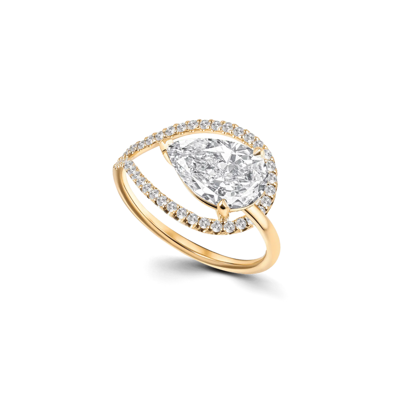 Floating Icon ring in yellow gold, featuring a curvy design with a 2ct pear-cut diamond, halo of diamonds, and a sleek single band.
