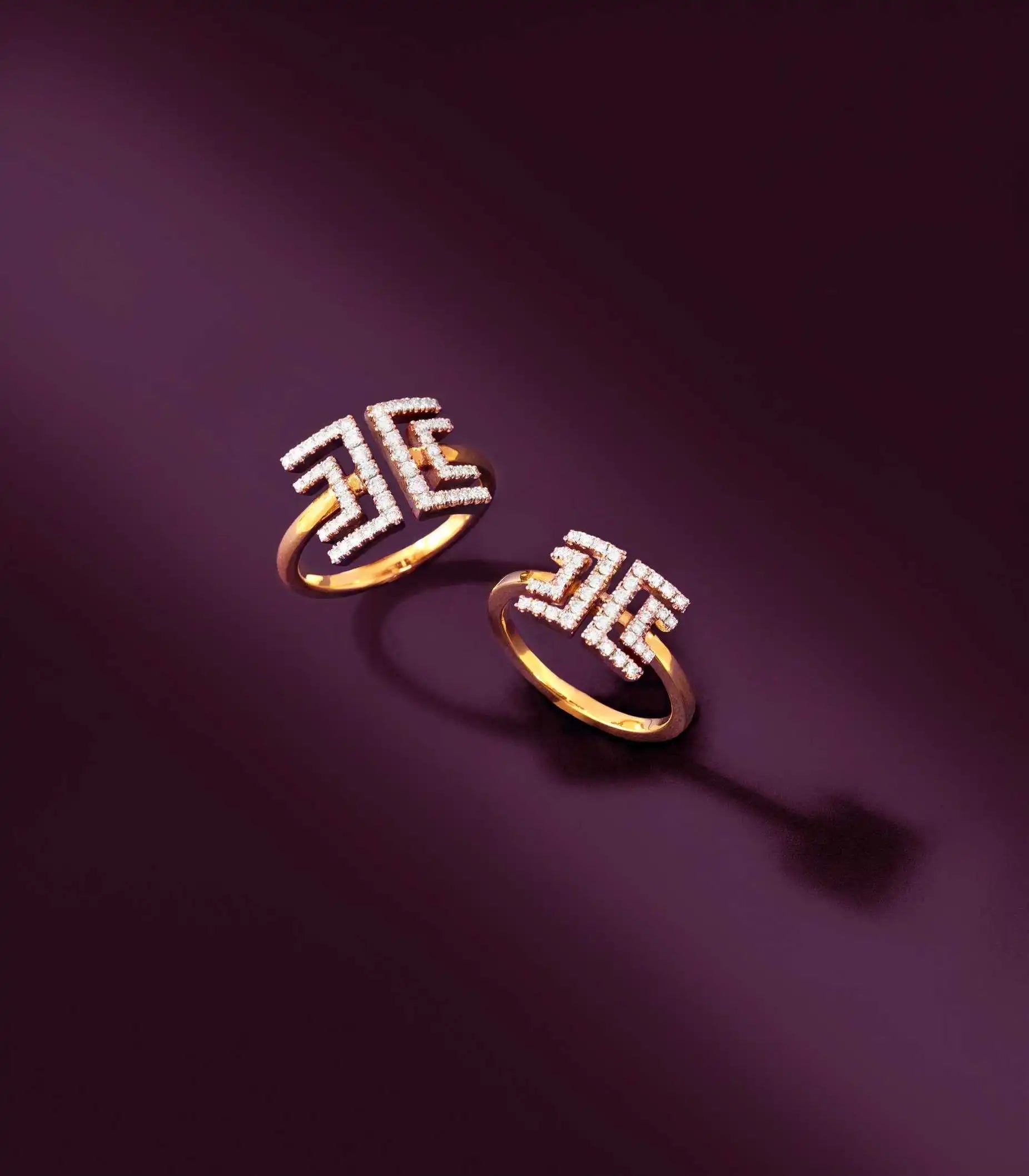 The Harper Petit and Harper Grand Entre-Deux rings standing in a ray of light, representing the ring category CTA.