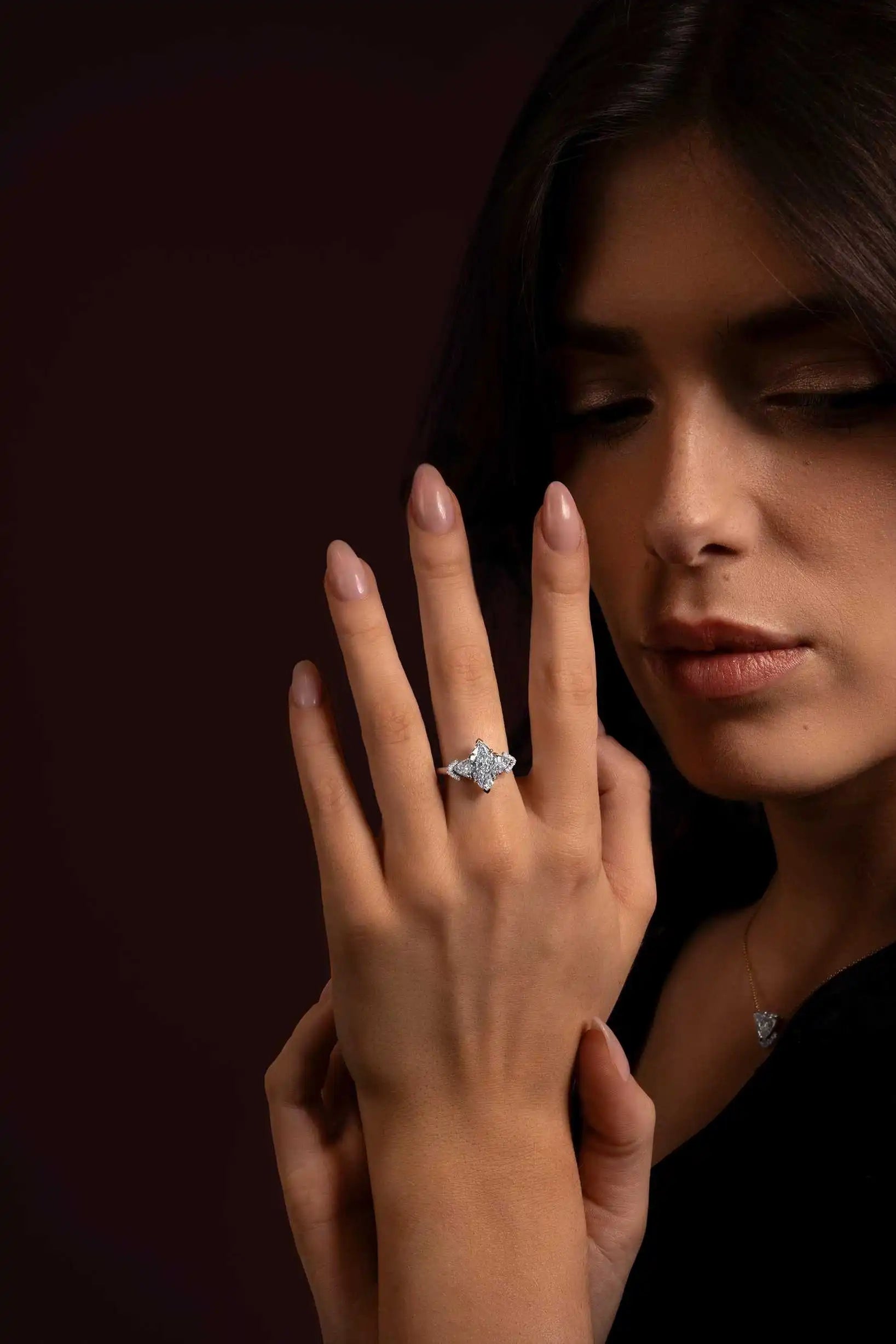 Model wearing the Angel’s Crown ring in white gold, featuring a 1.85ct marquise-cut lab-grown diamond with two triangle sides.