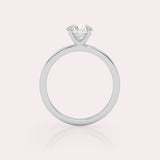 White Gold solitaire ring with a round-cut diamond, sideway view.
