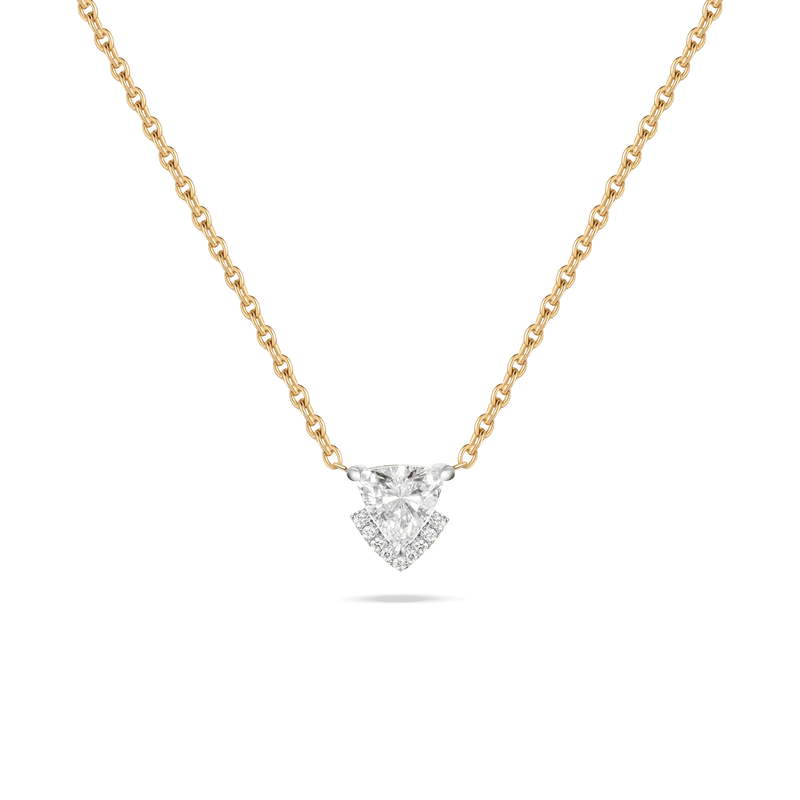 The Victoria Solo Necklace in featuring a triangle-cut diamond hanging from a yellow gold chain.